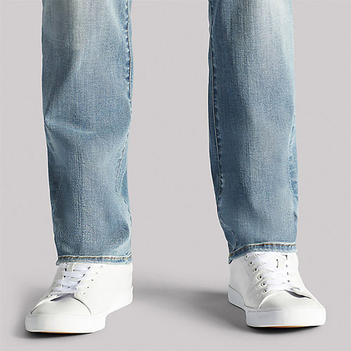 EXTREME MOTION ATHLETIC TAPERED LEG JEANS